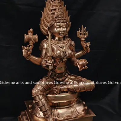 A bronze sculpture of Mahamariamman, a powerful form of the mother goddess. The five-headed serpent canopy and the intricate details of her weapons showcase our skill in complex iconography.