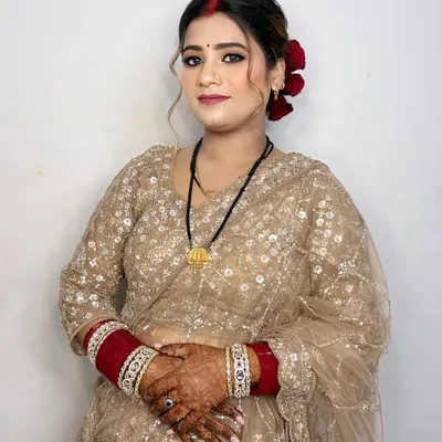 The bride's best friend looking stunning. I gave her a soft glam look with a classic red bindi and roses in her hair.