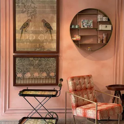 A beautiful shot from a home featured in Architectural Digest India. My parrot artworks and a custom trolley are seen here, complementing the elegant, blush-toned interior designed by We Design Studio.