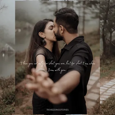 A romantic pre-wedding moment captured in the moody, atmospheric landscape of Vagamon. The couple shares a kiss, framed by nature, creating a timeless and cinematic save-the-date photo.