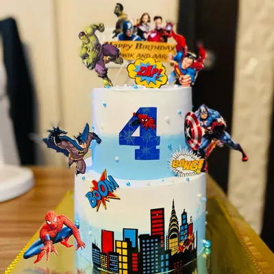 A dynamic two-tier Avengers cake featuring The Hulk, Captain America, and Spider-Man.