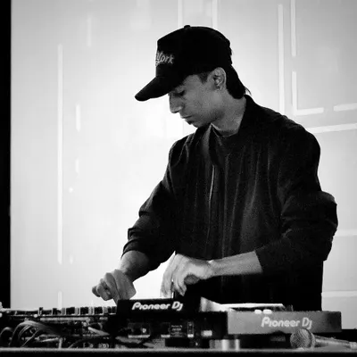 In the zone, focused on crafting the perfect mix. Every transition and track selection is done with care to maintain the party's energy flow.
