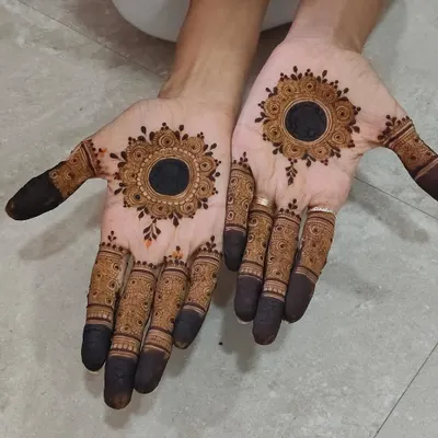 A beautiful mandala design with a dark center, creating a bold and striking look.