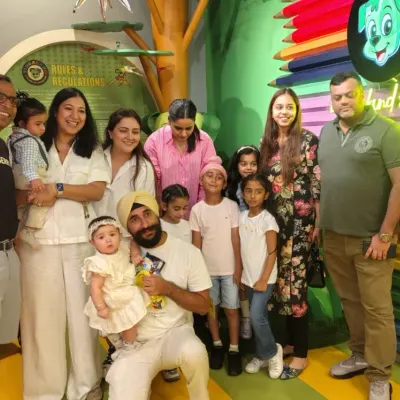 A large family group with multiple kids and adults poses for a photo. We can easily accommodate multi-generational gatherings for a day of fun.