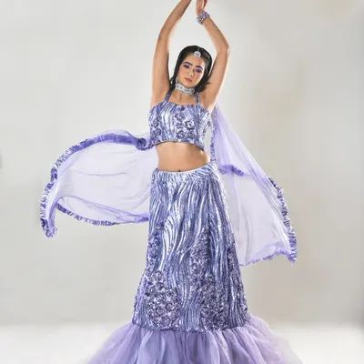 A dynamic, full-length shot of a modern engagement look. The makeup is glamorous yet soft, designed to photograph beautifully while the client is moving and dancing.