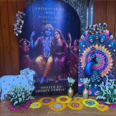 A beautiful 'Vrindavan ki Holi' setup for the Shorey family. The decor featured a large backdrop of Radha and Krishna, a peacock panel, and a cow cutout, creating a divine atmosphere.