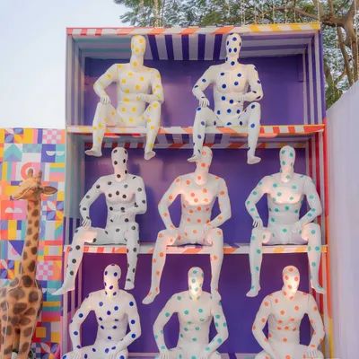 An army of polka-dotted mannequins stands guard, setting a playful and surreal tone for the carnival. This large-scale installation was designed to be a bold, Instagrammable moment right from the entrance.