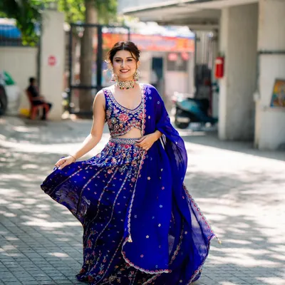 Another shot of our beautiful client twirling in the royal blue floral lehenga. Her smile says it all. It’s about feeling joyful and confident on your special day.