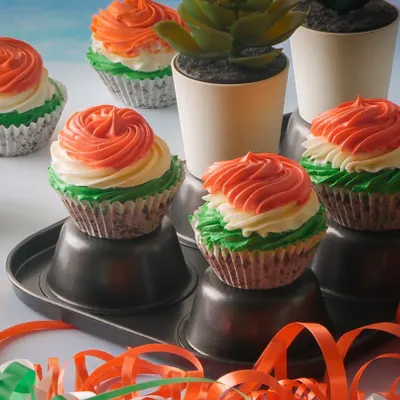 Our Republic Day cupcakes are frosted with beautiful tri-color rosettes. These vanilla cupcakes are a simple and elegant way to share your patriotic spirit with friends and family.