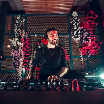A professional shot from a gig at a stylish venue. The floral and lighting design created an amazing backdrop. I'm comfortable playing in high-end clubs and for corporate clients who value a premium aesthetic.