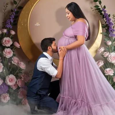 A truly romantic moment. The father-to-be kisses the baby bump in our celestial-themed setup, complete with a golden moon and a bed of clouds.