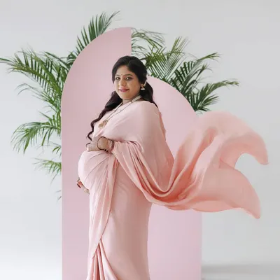 A beautiful, ethereal shot from a maternity session. The mom-to-be is wearing a flowing pink saree, and I created a soft glam makeup look with pink eyeshadow and a matching lip to complement her outfit. The flowing fabric adds a lovely sense of movement.