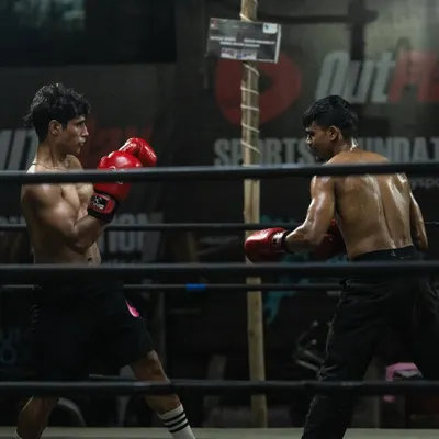 Two fighters sparring in our professional ring. This is where technique is tested and sharpened under real pressure.