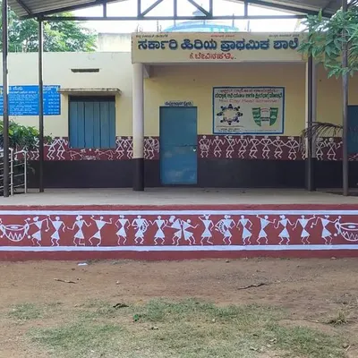 The completed Warli art border on the stage of a government school. This project was about bringing traditional Indian folk art to the children, creating an inspiring and culturally rich environment.