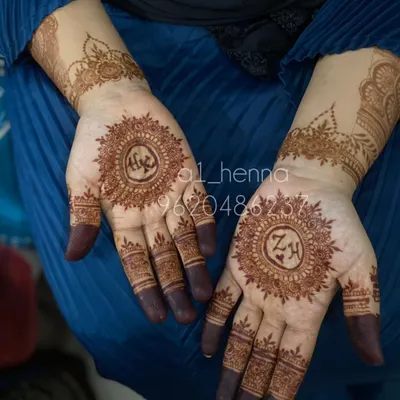 A beautiful example of personalization, with the initials 'A' and 'ZH' incorporated into the center of traditional mandala designs.