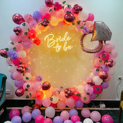 Our most requested "Bride to be" decoration, featuring a full balloon ring, neon sign, and a large diamond ring foil balloon. The mix of pinks, purples, and fairy lights creates a festive and photo-ready atmosphere for your bachelorette party or bridal shower.