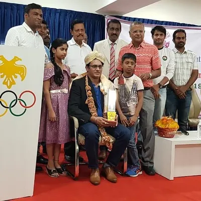 A moment of honor, being felicitated by the Karnataka State Rifle Association for my participation in the Rio Olympics and for receiving the Arjuna Award. These experiences shape the core of my coaching philosophy.
