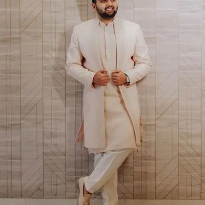 A stylish portrait of the groom, looking sharp and confident in his elegant sherwani. We make sure the groom's solo shots are just as impressive.