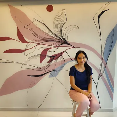 Here I am with a finished freehand boho-style wall art. This modern, freestyle piece uses pleasant colors and nature elements to create a soothing feel in a luxury home's living room.