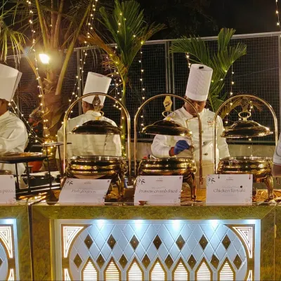 Our chefs are hard at work at a beautifully lit outdoor wedding. We use premium, illuminated buffet counters and traditional brass serving dishes to create a luxurious feel for your celebration.