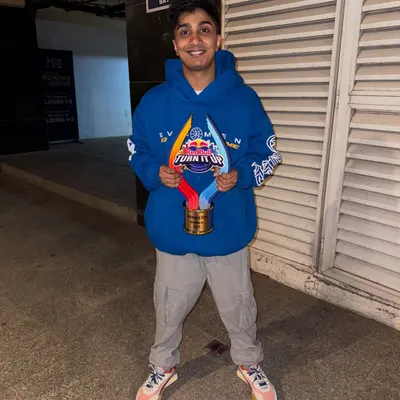 Holding my first-ever award from the Red Bull "Turn It Up" competition. A proud moment and a big thank you to everyone who supported me.