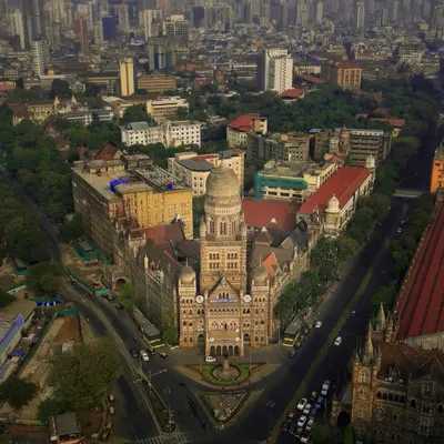 A definitive aerial portrait of the BMC building in South Mumbai. The symmetrical composition highlights its architectural grandeur, making it a perfect shot for showcasing the city's heritage.