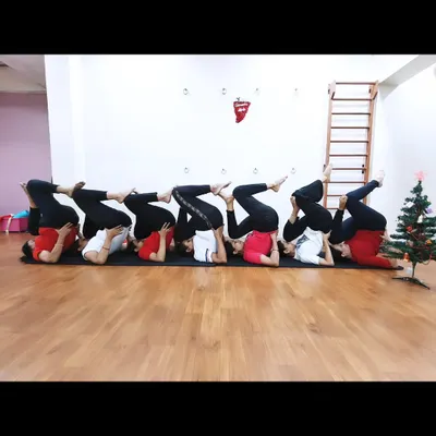 Our students celebrating Christmas with a creative group yoga pose. We believe in finding joy and connection in our practice.
