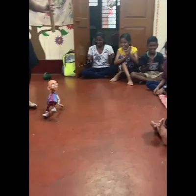 A child from Makkala Jagriti is captivated as our 'Popo' thatha puppet seems to walk all by itself. The laughter and high energy in these community shows are absolutely contagious.