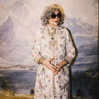 The legendary Zeenat Aman styled for 'The Royals' on Netflix. This look features a full length printed jacket by Anita Dongre, paired with layers of magnificent Polki and pearl necklaces for a truly regal effect.