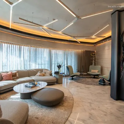At a luxe residence in Lodha World View, the apartment's inherent curves create a seamless flow between spaces. The spacious 3,800 sq. ft. living area reflects a perfect balance of opulence and elegance, with expansive windows framing breathtaking views of Mumbai.