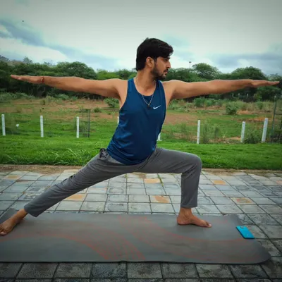 The Virabhadrasana 2, or Warrior Pose, is a fundamental asana for building strength and stability. I teach this to help you strengthen your leg muscles, improve focus, and challenge your body's balance.