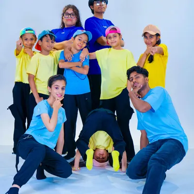Our young b-boys and b-girls showing off their attitude and style during a studio photoshoot. We encourage self-expression and confidence in all our students.
