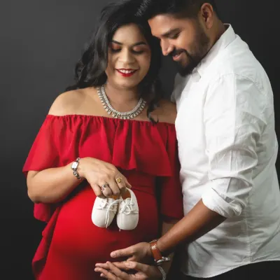 Those tiny shoes represent a huge, wonderful dream coming true. We love capturing this classic maternity pose with couples, focusing on the hands that will soon hold their little one.