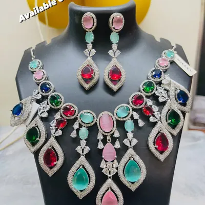 Make a statement at your Mehendi or Sangeet with this eye-catching multi-colored jewellery set. The mix of colorful gemstones is designed to complement a wide range of festive lehengas and outfits, giving you a bright and celebratory look for the party.