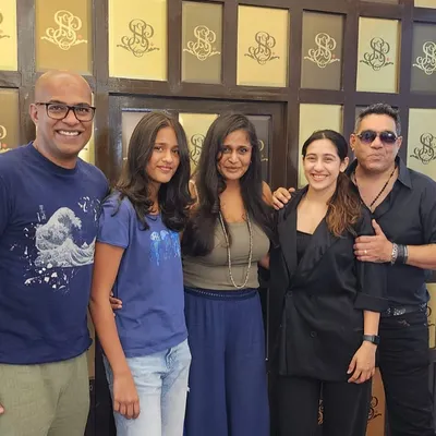 A family visit to the salon is always a good time. I'm here with a group of happy clients after their appointments, all looking refreshed and ready to go.