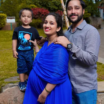 A heartwarming family portrait with their first child. I focus on capturing the natural interactions and joy as your family prepares to welcome a new member.