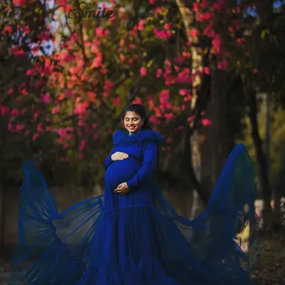 This flowing teal blue maternity gown is one of my most requested pieces. It features a detachable net skirt and a comfortable fish-cut inner dress, making it perfect for creating dramatic, flowing shots during your maternity photoshoot.