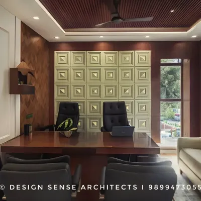 This is a completed factory office we designed in New Delhi. The goal was to create a professional and comfortable environment with rich wood tones, a textured feature wall, and elegant furniture that feels both commanding and welcoming.