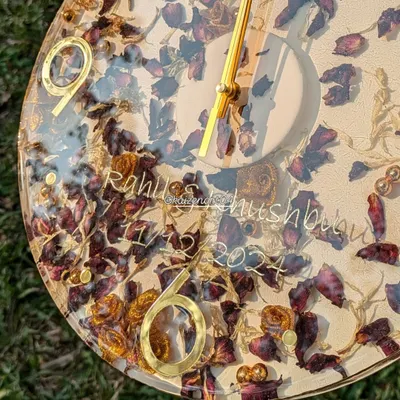 Your wedding flowers are too precious to throw away. Here, I've preserved a couple's varmala flowers in a 12-inch wall clock, complete with their names and wedding date. It's a beautiful way to remember your special day, every day.