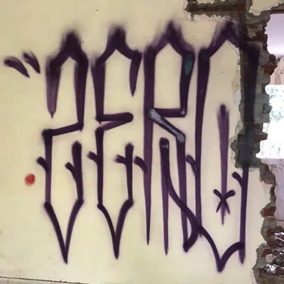 This is one of my signature 'ZERO' pieces, painted on a broken wall at the Arts Faculty in Vadodara. The sharp, pointed letters are a take on a gothic handstyle, done with purple spray paint to stand out against the pale wall.