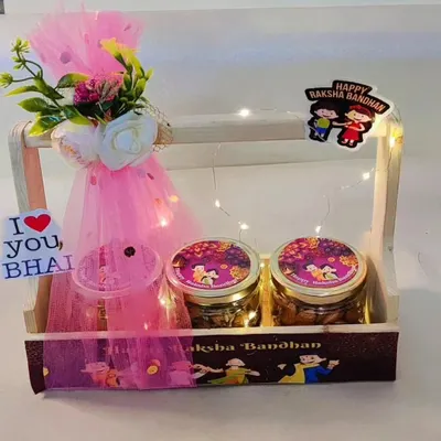 This beautifully lit wooden basket is a perfect Rakhi gift. It includes three jars for treats like cookies and muesli, a decorative floral bunch, and an "I Love You, Bhai" tag.