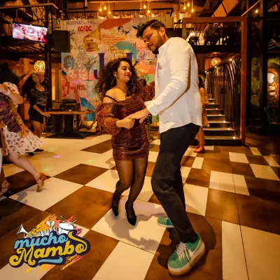 The dance floor is calling. A candid moment from our "Mucho Mambo" night, where every dance is a celebration.