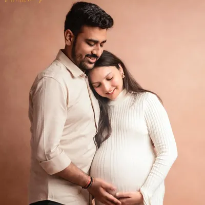Creating elegance from simplicity. This sweet and simple couple's portrait in my studio beautifully captures the tenderness and anticipation of waiting for their little one.