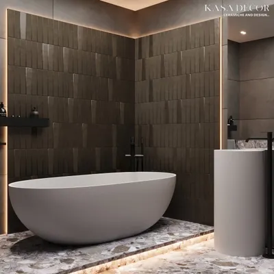 This bathroom achieves a moody, tranquil atmosphere through a masterful play of textures. The back wall features bold, vertically-oriented 3D tiles that create a sense of height, while the terrazzo-style flooring adds a layer of visual complexity. The freestanding tub becomes the centerpiece in this minimalist yet luxurious retreat.