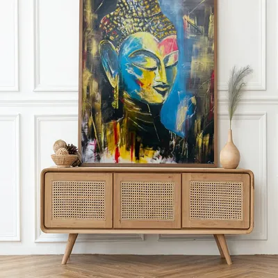 This large acrylic painting of Lord Buddha is all about finding serenity in stillness. The vibrant colors and expressive strokes are meant to bring a sense of peace to any space.