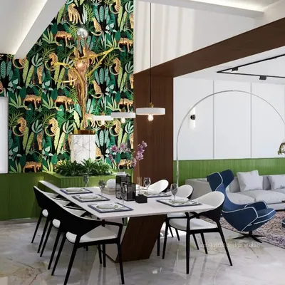 This open-plan living and dining area is designed to be the emotional core of the house. The layout fosters togetherness, allowing for easy interaction between the kitchen, dining table, and lounge area. The feature wallpaper adds a dramatic yet tasteful touch of nature.