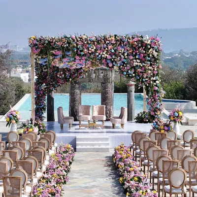 A breathtaking mandap overlooking the hills of Udaipur. I designed this pastel floral paradise by the poolside to feel both grand and intimate, creating a serene and royal setting for the wedding vows.