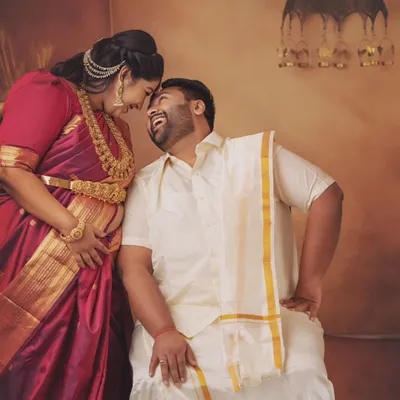 The laughter and love between this couple is just everything. Dressed in traditional South Indian attire, this moment captures the pure happiness of their journey together.