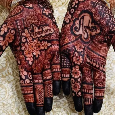 This is the power of a mature, organic henna stain. Notice the incredible depth of color and the crispness of the design, which includes the names 'Abraham' and 'Azmat'. My chemical-free henna for weddings ensures a beautiful and safe experience.