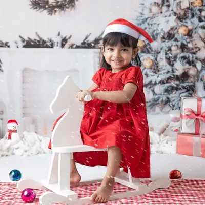 A little one's first Christmas. My festive mini sessions include adorable Santa outfits and a winter wonderland setup to capture this special milestone.